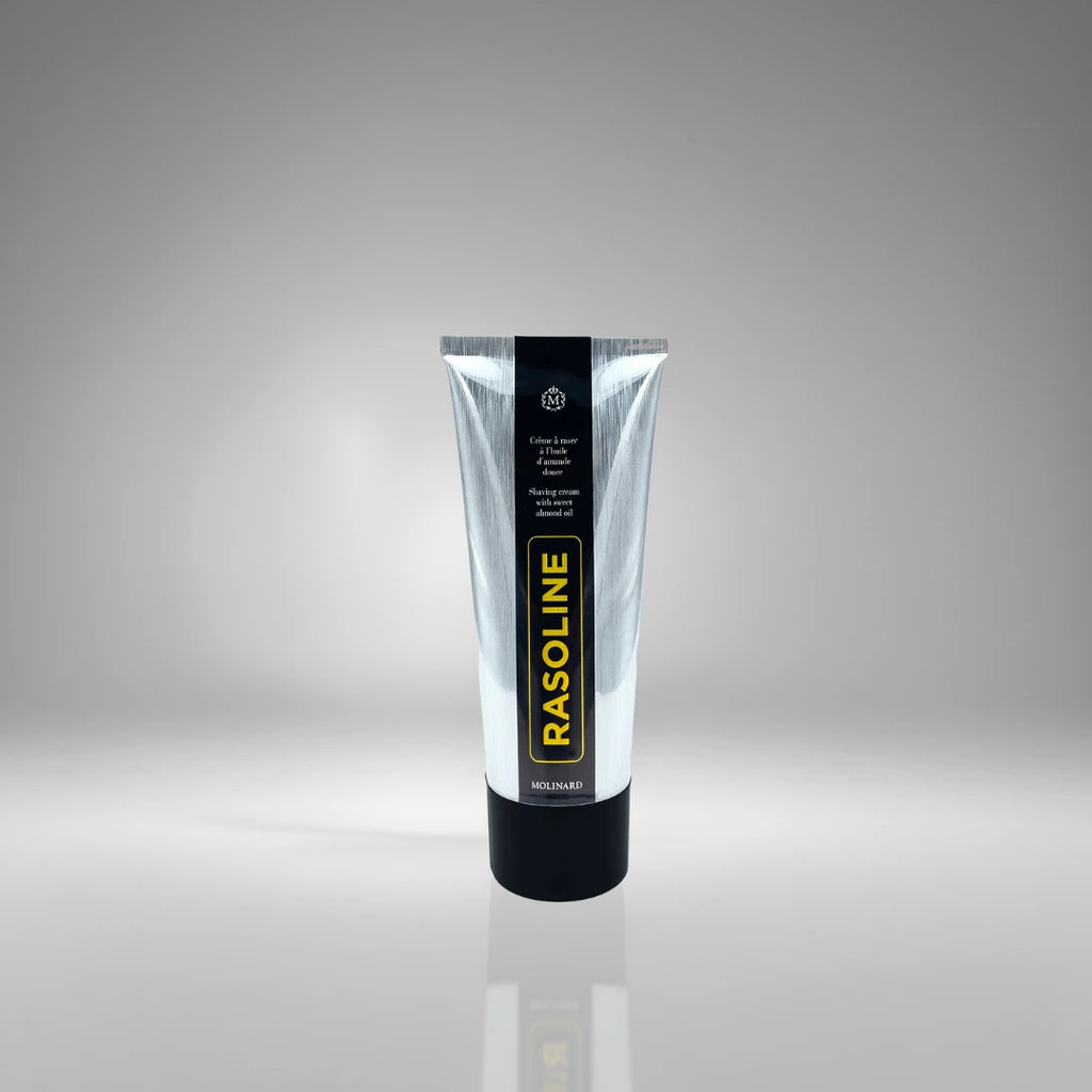 Tube de crème à raser Rasoline de Molinard, soin traditionnel à l'huile d'amande douce pour un rasage confortable et protégé.