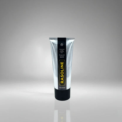 Tube de crème à raser Rasoline de Molinard, soin traditionnel à l'huile d'amande douce pour un rasage confortable et protégé.