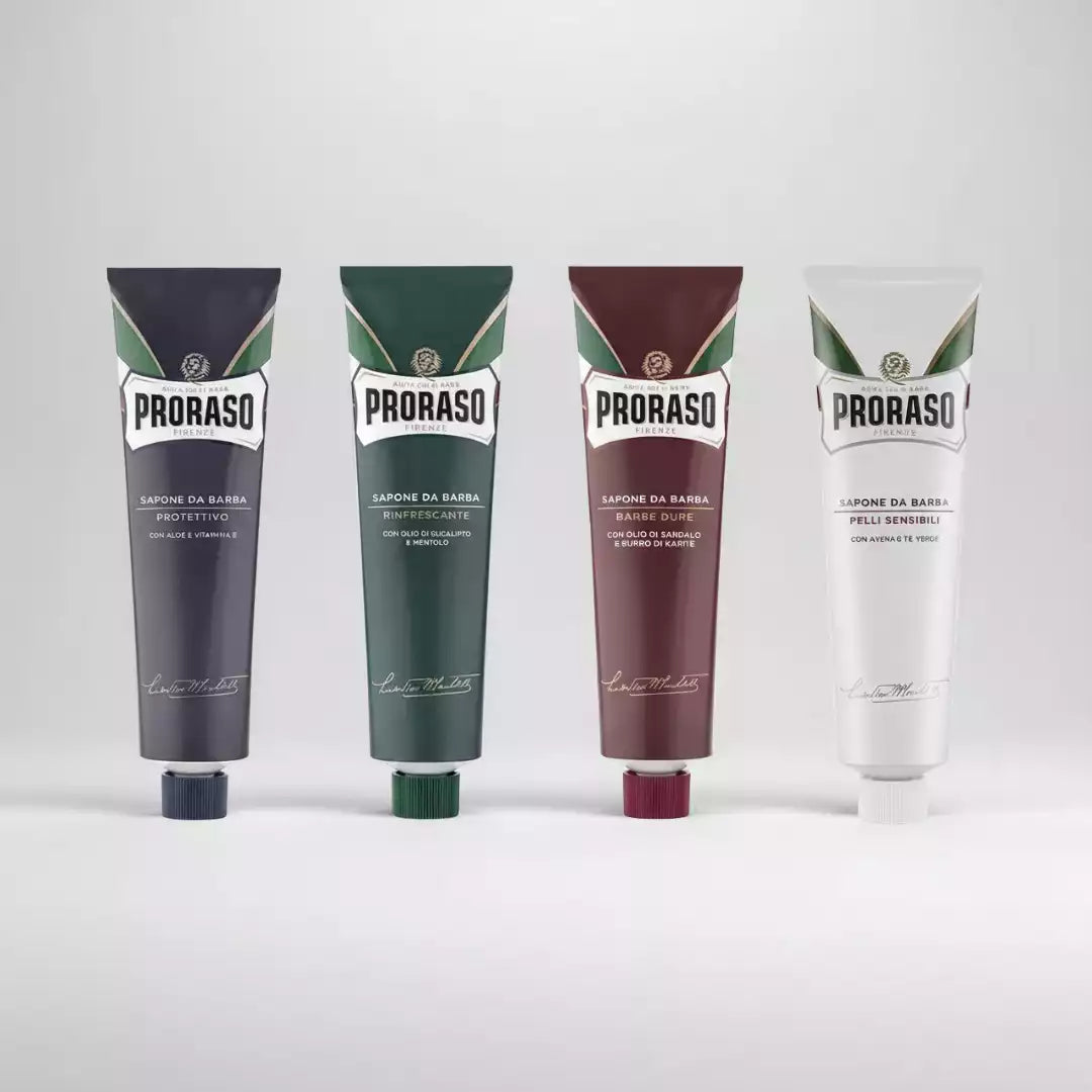 Gamme complète des tubes de crème à raser Proraso (bleue, verte, rouge et blanche). Adaptée à chaque type de peau et de barbe.