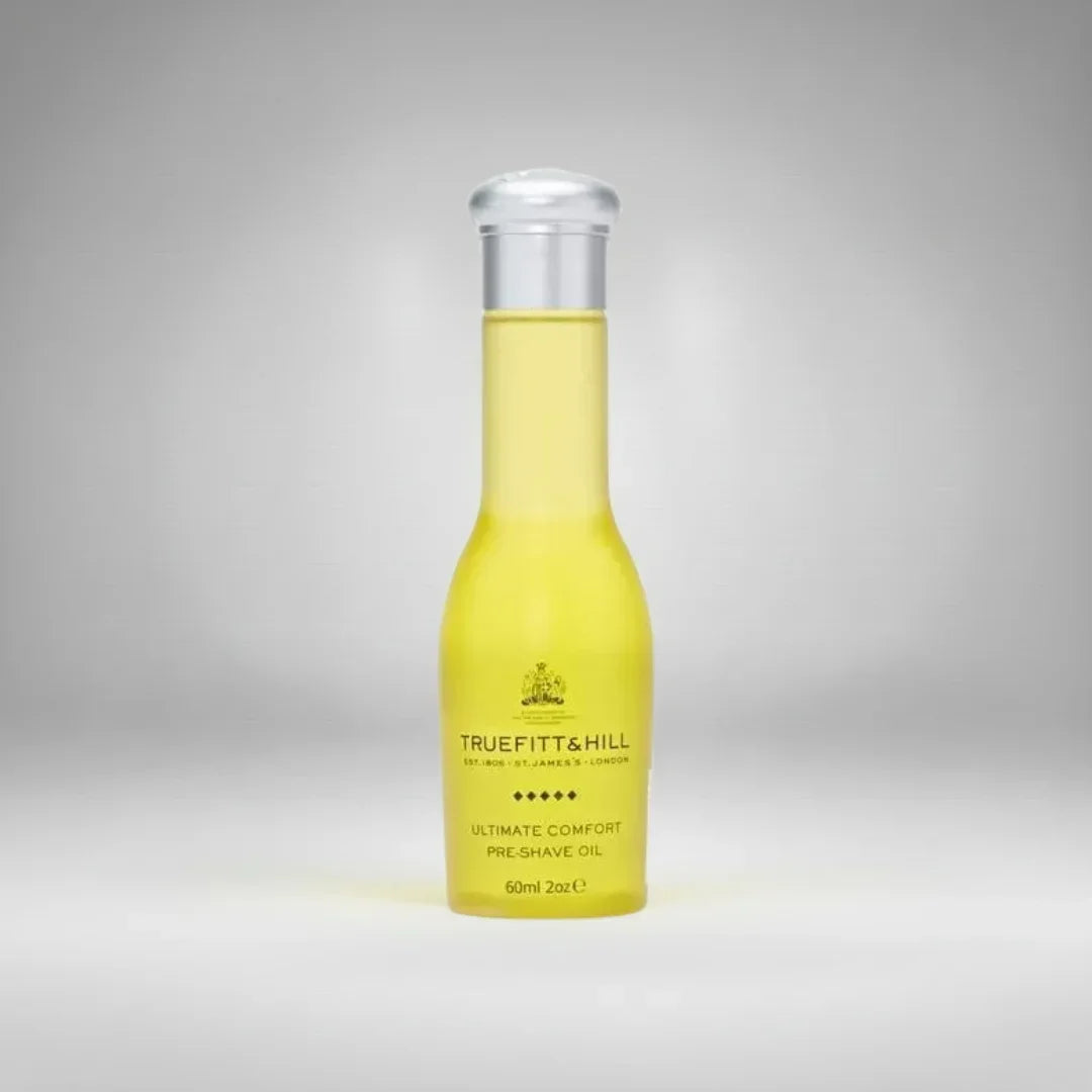 Huile de pré-rasage Ultimate Comfort de Truefitt & Hill (60ml). Un soin luxueux qui prépare la peau et assouplit le poil pour un rasage confortable et sans irritation.