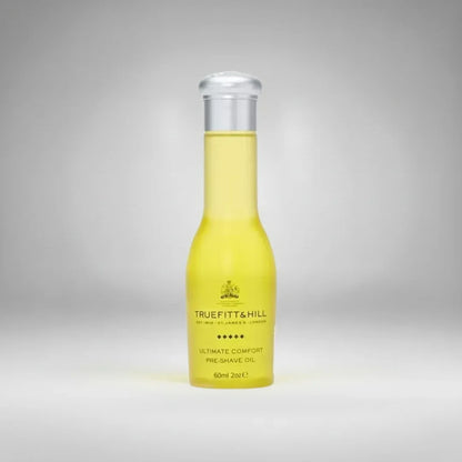 Huile de pré-rasage Ultimate Comfort de Truefitt & Hill (60ml). Un soin luxueux qui prépare la peau et assouplit le poil pour un rasage confortable et sans irritation.
