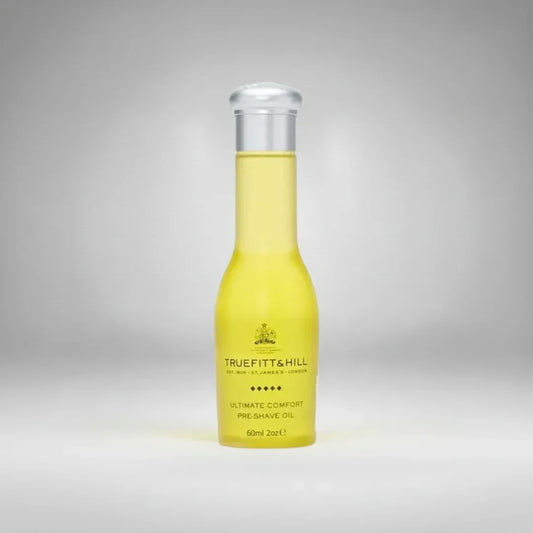 Huile de pré-rasage Ultimate Comfort de Truefitt & Hill (60ml). Un soin luxueux qui prépare la peau et assouplit le poil pour un rasage confortable et sans irritation.
